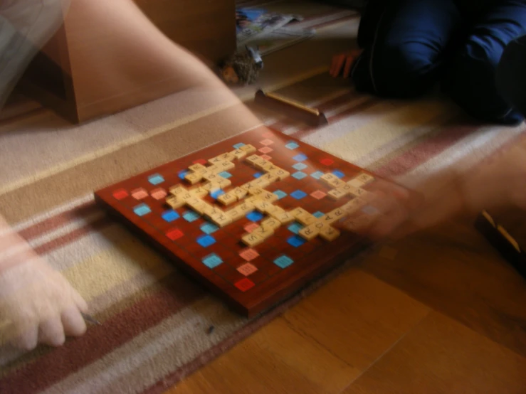 two legs, a wooden table with square shapes and small squares
