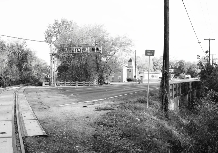 old rail road crossing at a rural intersection