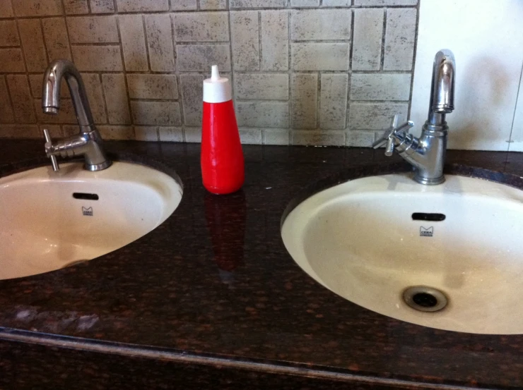 two sinks that have been cleaned and are next to each other
