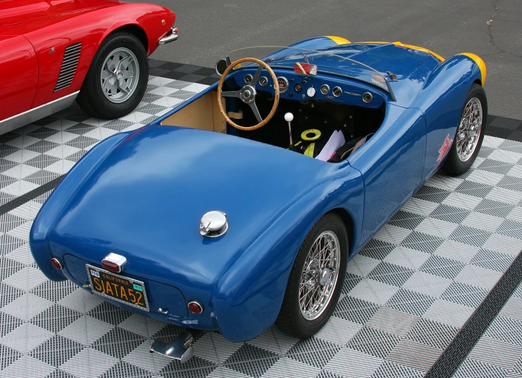 an old style car in a parking lot