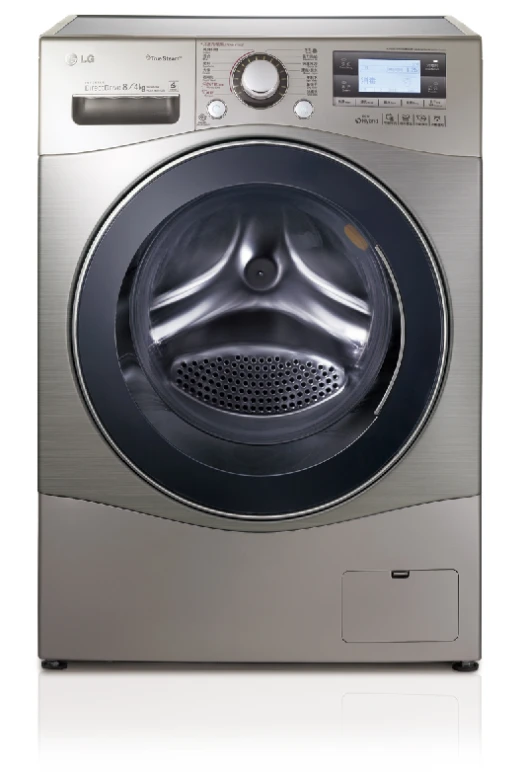 a very large silver washing machine sitting on a table