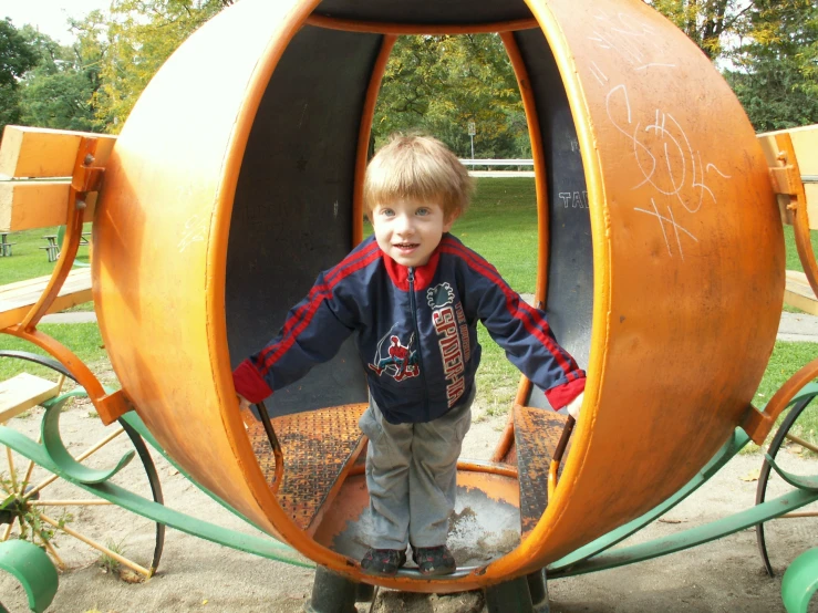 a little boy who is standing in a strange looking thing