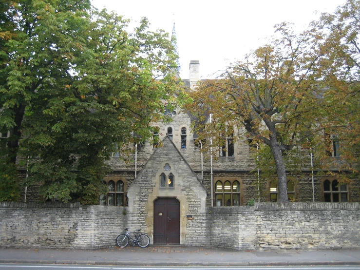 an old stone building with a bicycle parked outside