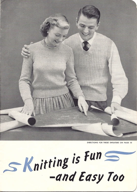 a man and woman standing next to each other holding scissors