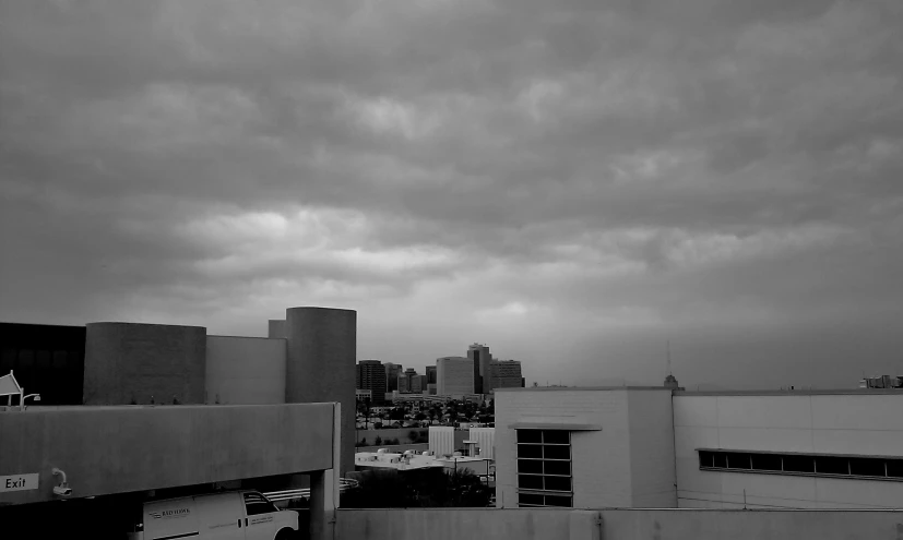 a picture taken from a rooftop looking across a city