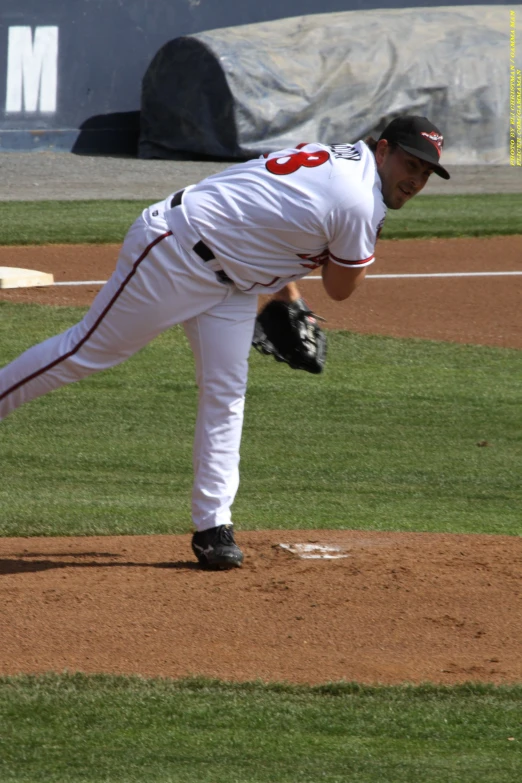 a pitcher throwing the ball to the opposing team