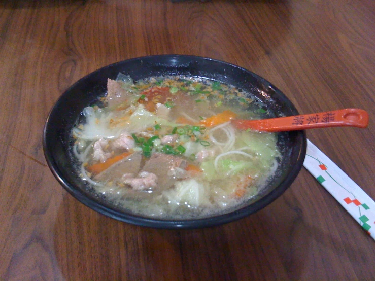 the soup has various ingredients such as meat, broth and onions