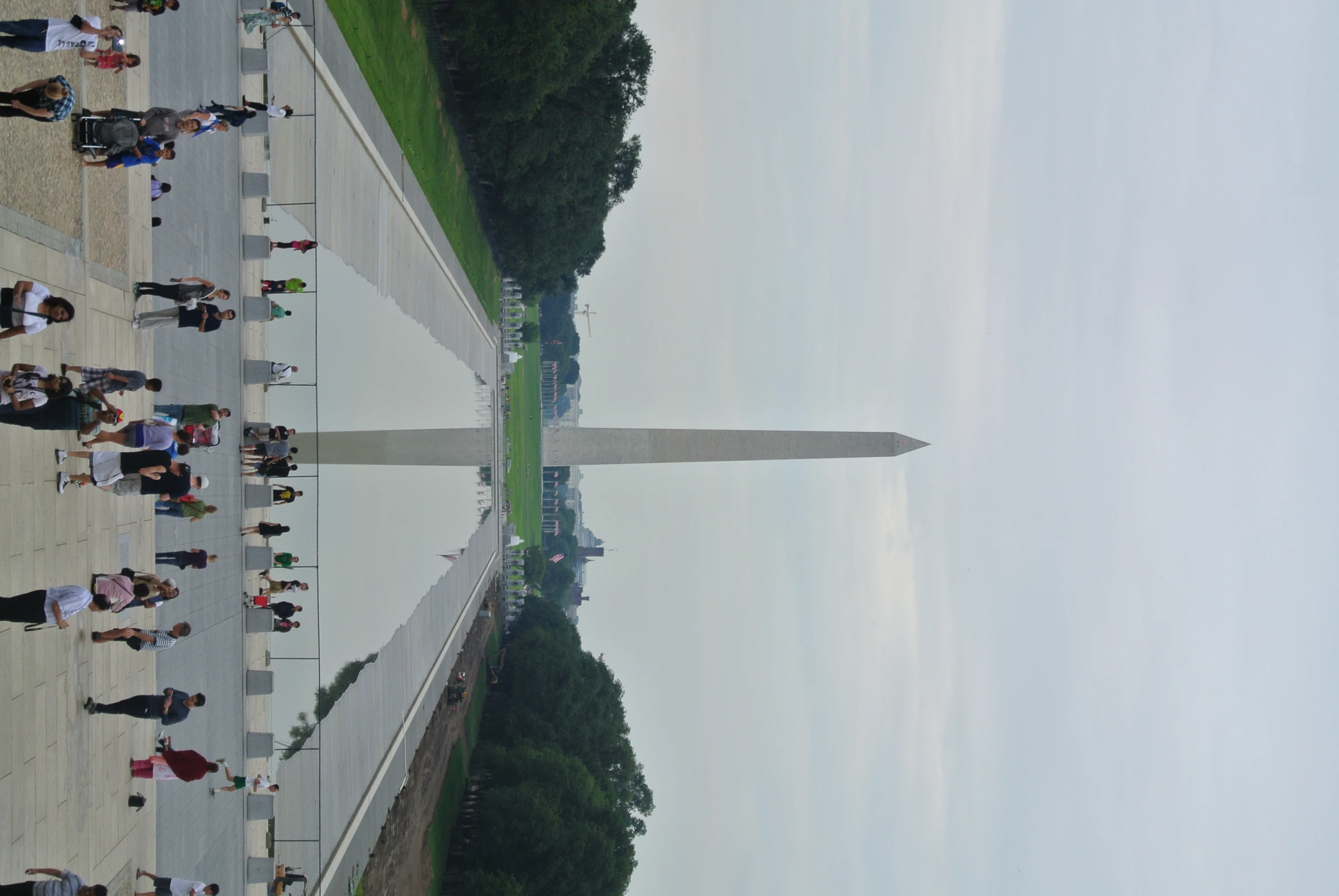 people are standing in front of the washington monument