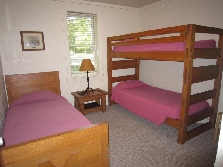 a couple of bunk beds in a small room