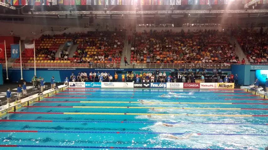 a competition swimming pool with the crowd watching it