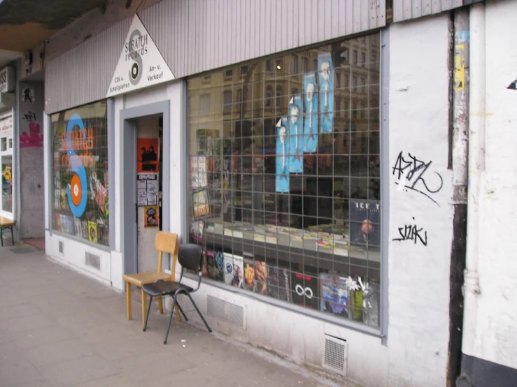 the exterior of a window with graffiti on the side