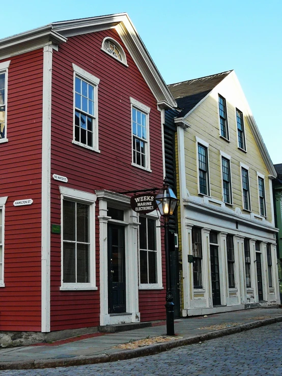 a number of buildings on a street with a light post