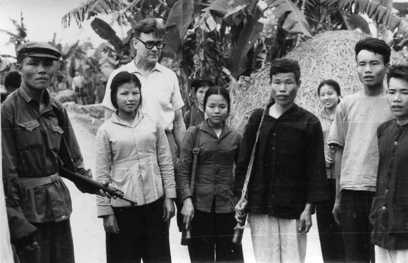 a black and white image of a family outside