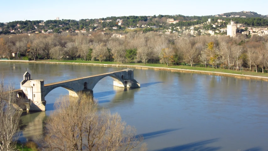 a bridge across the river in a town