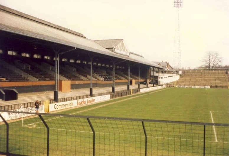 a view of a stadium field with a soccer goal