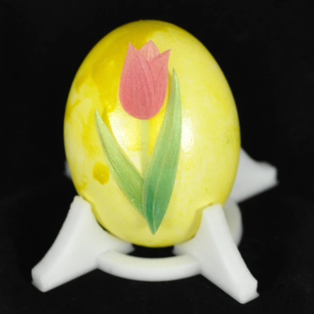 an apple with flower painted on it