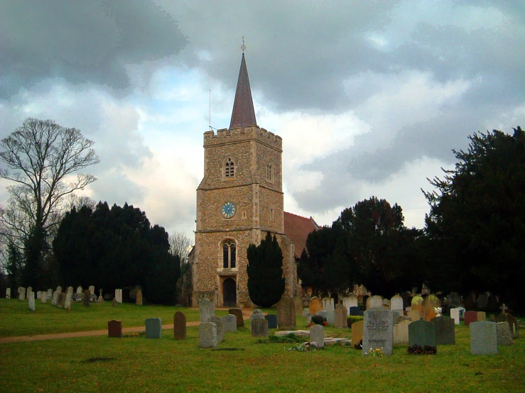 this is a graveyard with a tall tower in the background