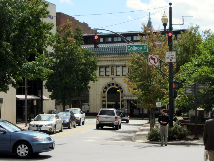 a city street filled with cars and traffic lights