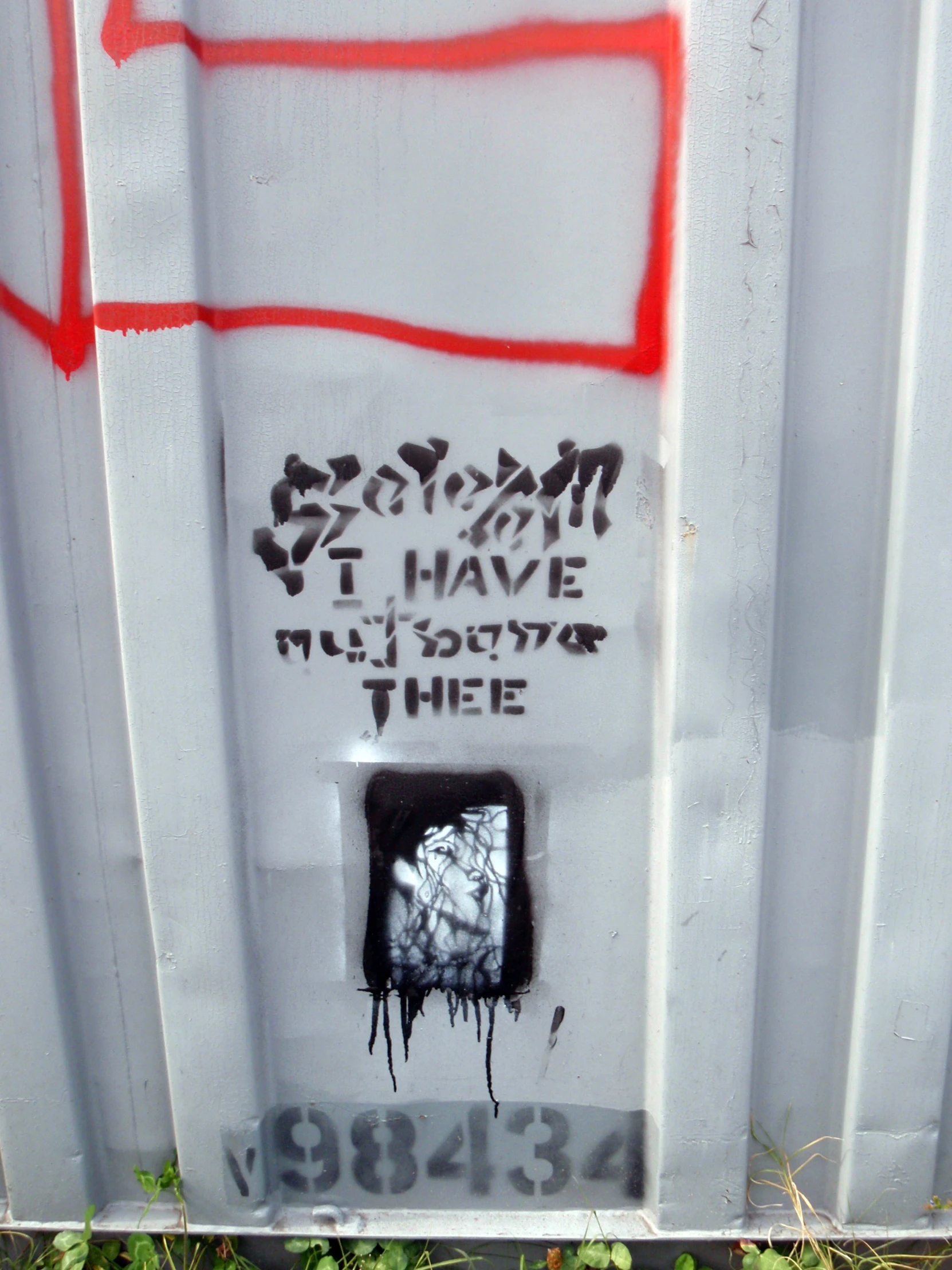 some graffiti on a white box with the door open