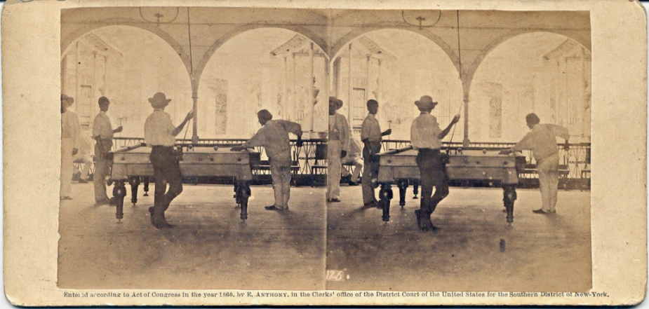 a sepia pograph shows a man and his group of women holding their hands together