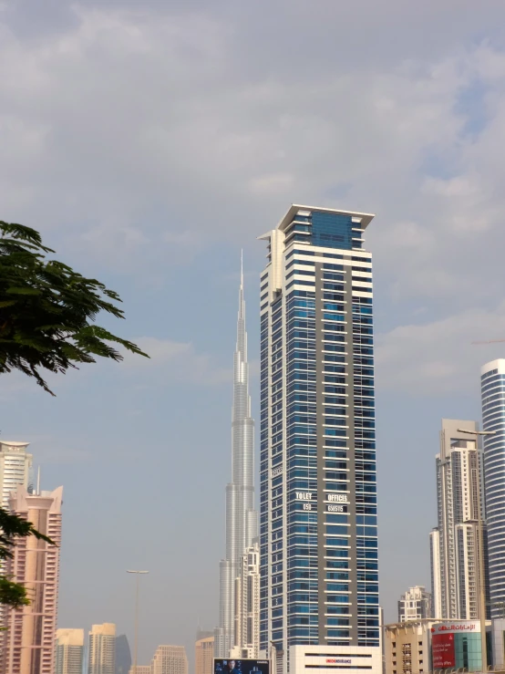 two tall buildings towering over a city