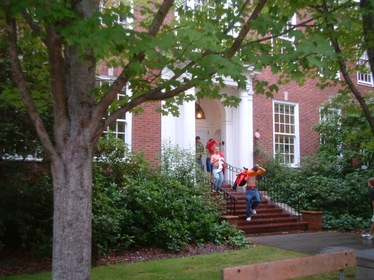 a person holding an umbrella and jumping down some stairs