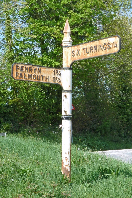 a couple of road signs on the side of the road