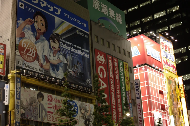 an asian billboard with various asian posters on the wall