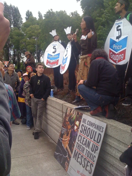 protesters hold signs on the wall during a protest