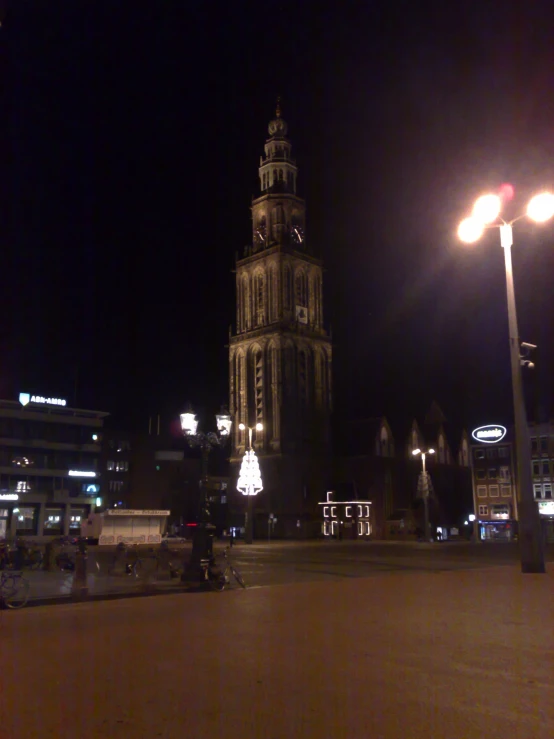 an old style building is lit up at night