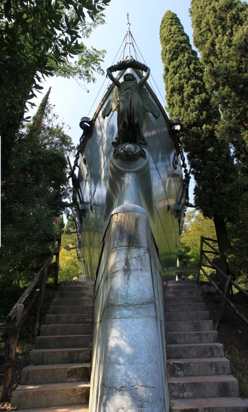 an airplane sitting on some steps near some trees