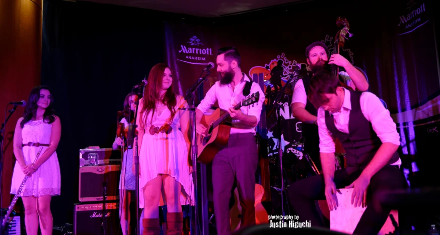 a band playing on stage with their instruments