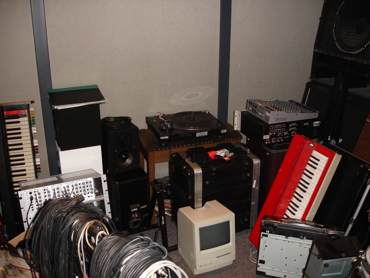 a room full of musical equipment and electronics