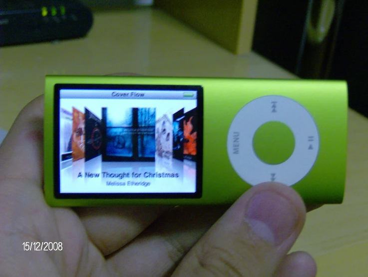 a green ipod has the image of an old videogame