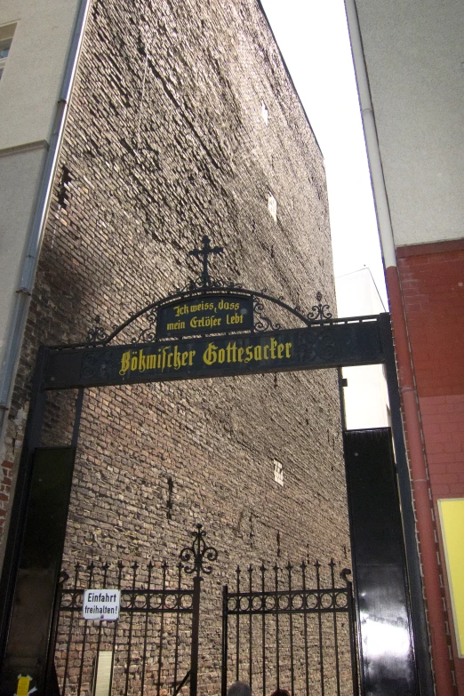 an entrance to the building with a large sign above it