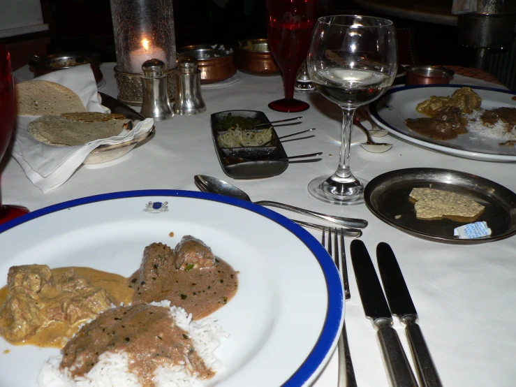 a plate is on the table with food and silverware