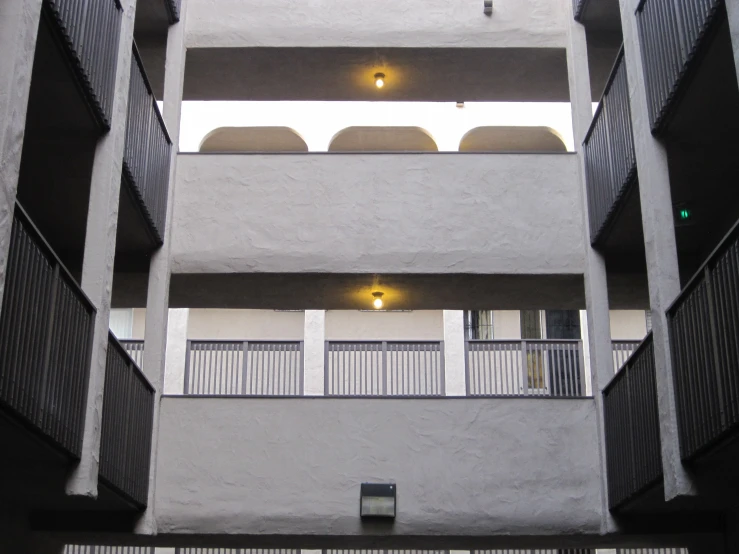 looking up at a modern apartment building from the outside