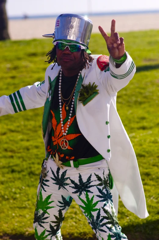 a man in hip hop outfits on the grass