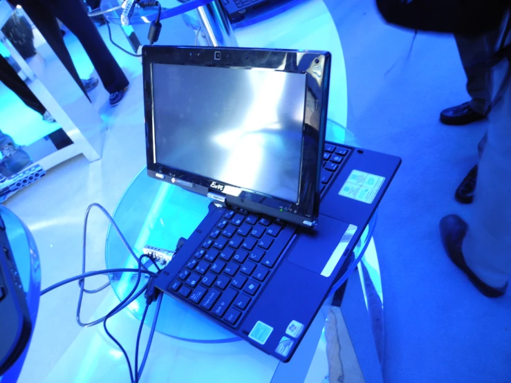 laptop with a lcd screen sitting on top of a desk