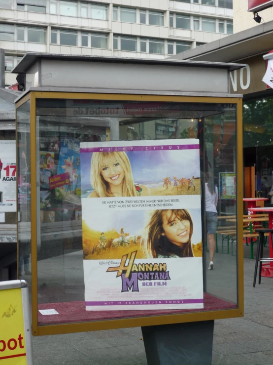 a movie poster is on a display box