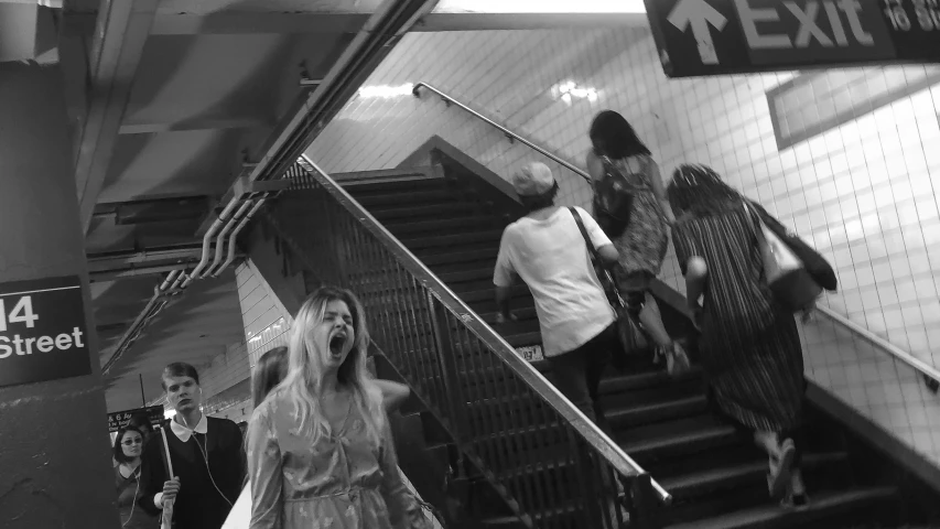 two people going down the stairs and one person wearing a robe