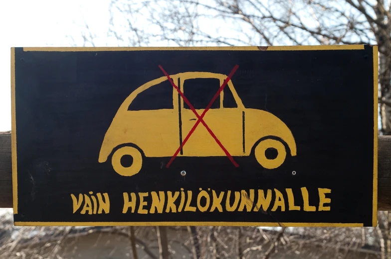 a sign reading van henkloxundale with the symbol of a car