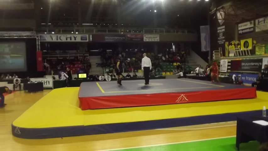 people watching an air tram doing tricks on a court