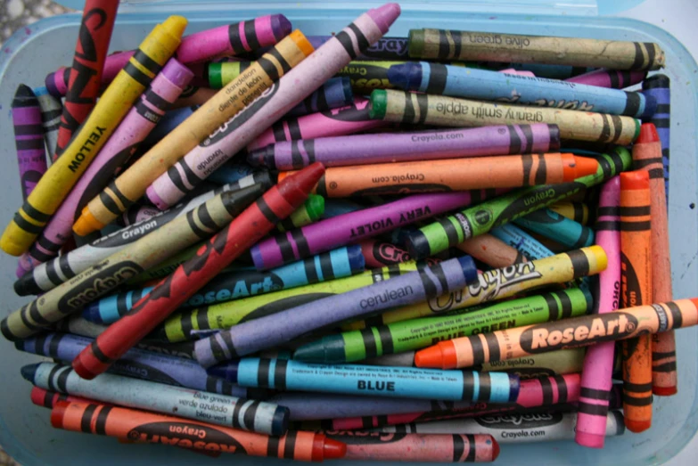 colorful crayons all over the back of an empty container