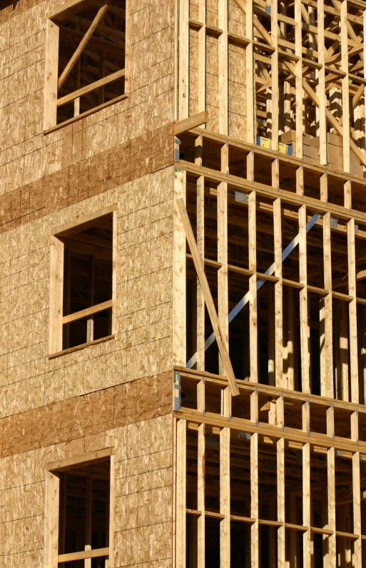 a construction building under construction with wooden framing