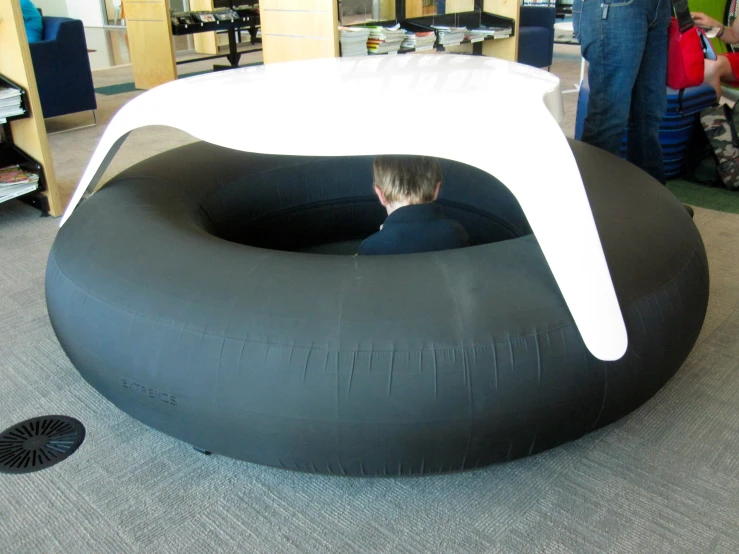 people in a room with black and white furniture