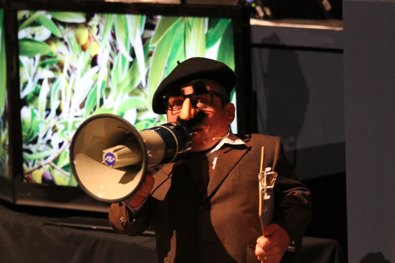 a man playing a sound board with a megaphone