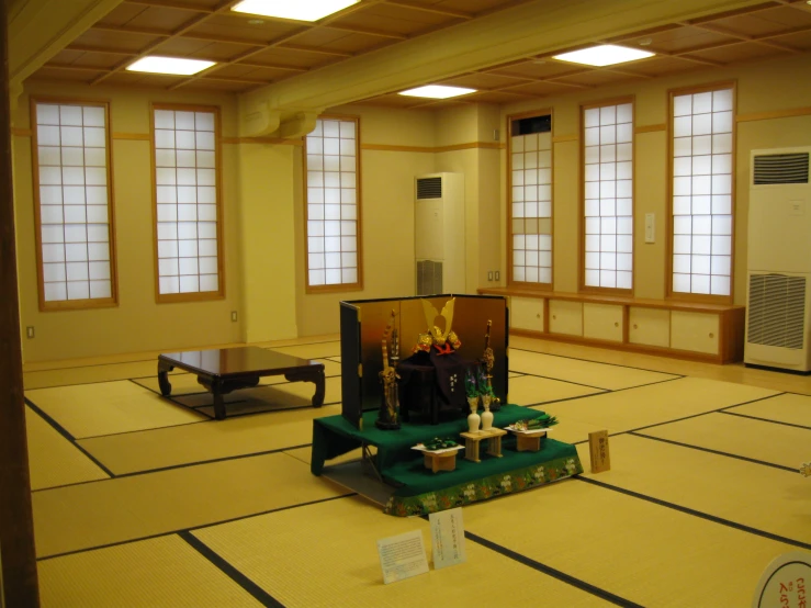 a room that has yellow flooring and windows
