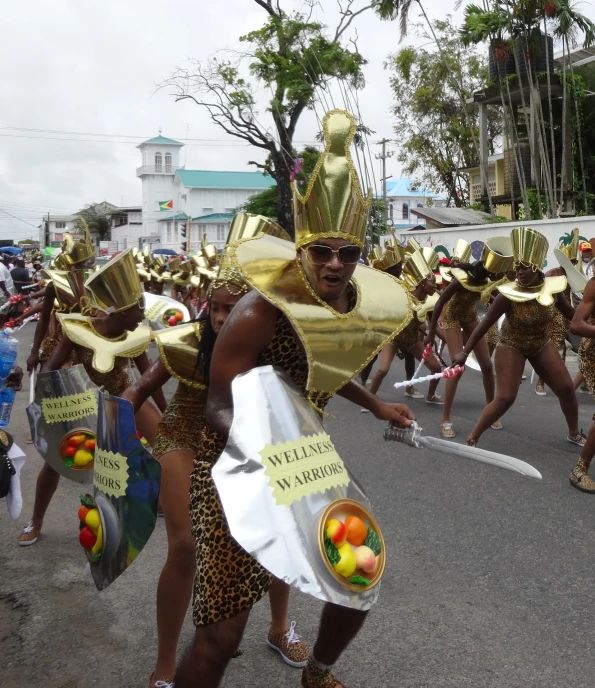 the person in the parade has a banana wrap around his neck