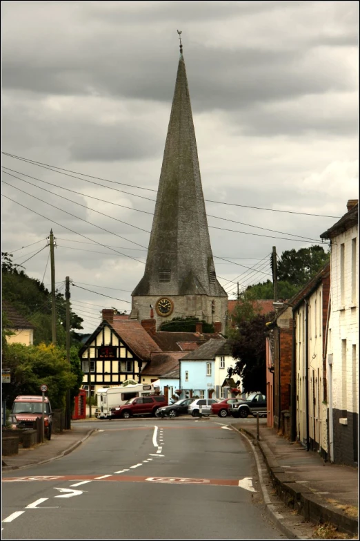 a church steeple towering over the city street